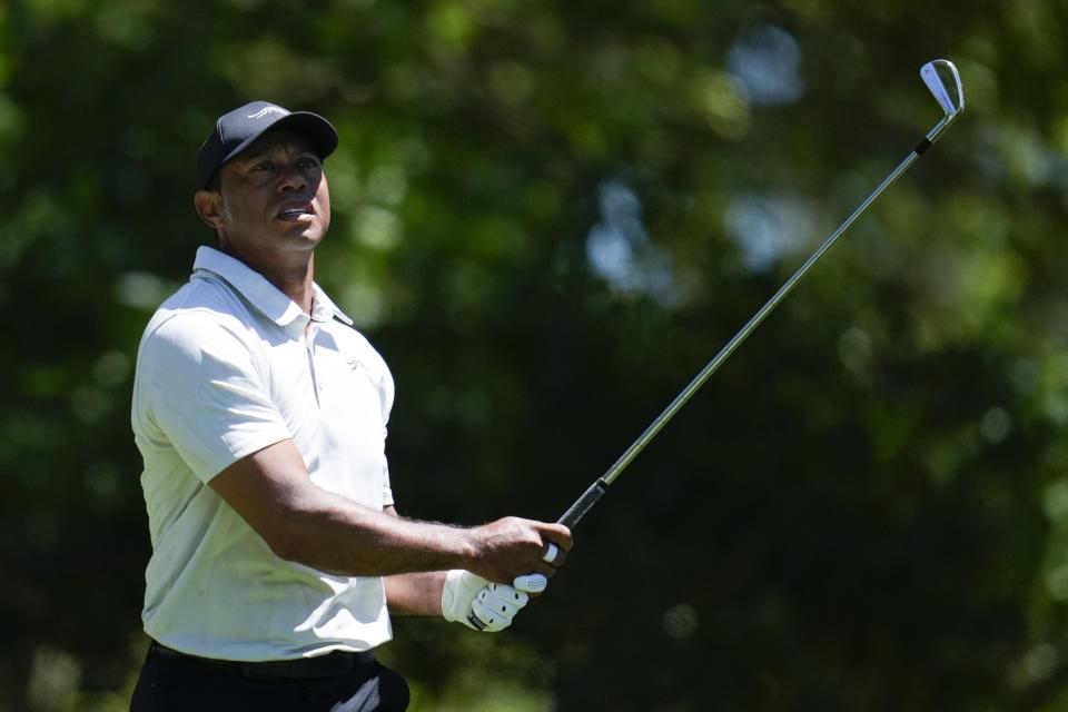 Tiger Woods watches his tee shot on the fourth hole during third round at the Masters golf tournament at Augusta National Golf Club Saturday, April 13, 2024, in Augusta, Ga. (AP Photo/Ashley Landis)