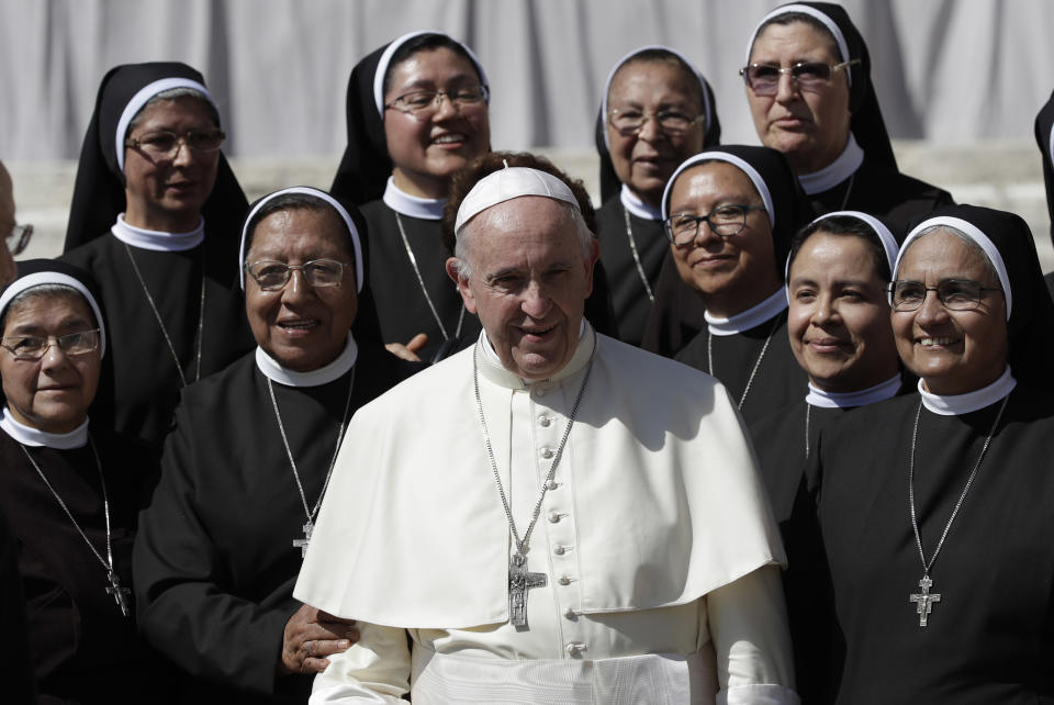 Pope Francis poses for a photo with nuns at the end of his general audience in St. Peter's Square at the Vatican Wednesday, Sept. 12, 2018. (AP Photo/Alessandra Tarantino)