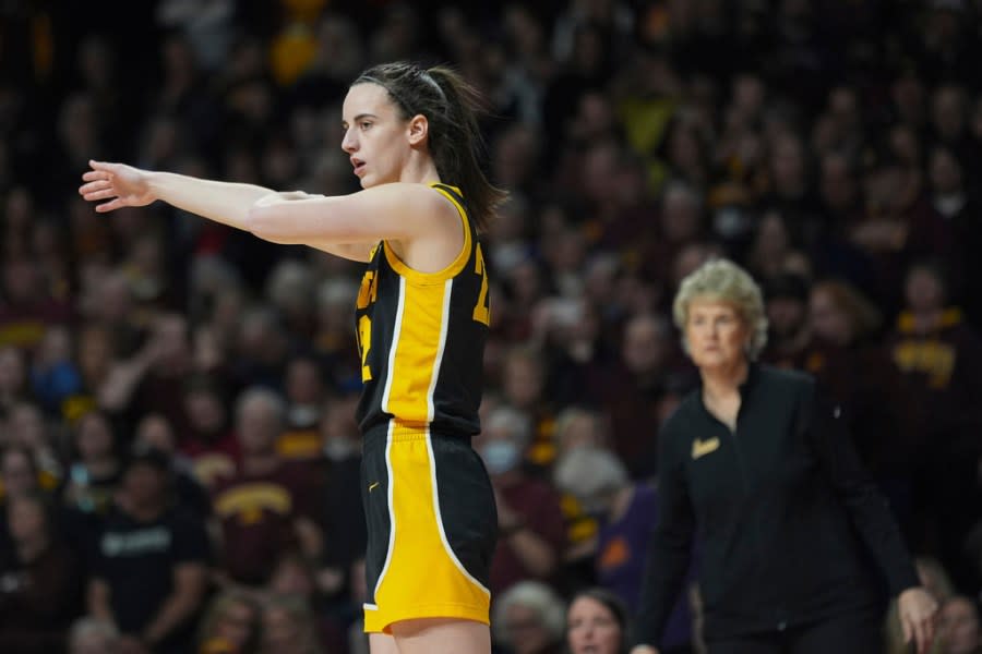 Iowa guard Caitlin Clark gestures as Lisa Bluder looks on during an NCAA college basketball game against Minnesota, Wednesday, Feb. 28, 2024, in Minneapolis. (AP Photo/Abbie Parr)