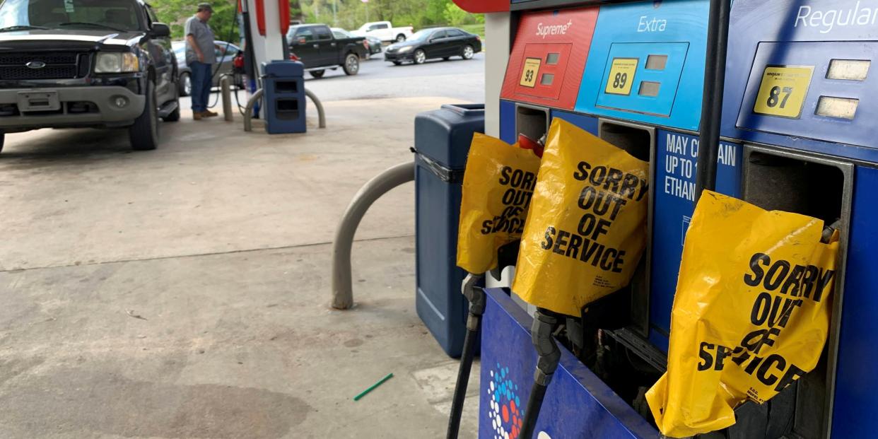 Out of service fuel nozzles are covered in plastic on a gas pump at a gas station in Waynesville, North Carolina, after a gasoline supply crunch caused by the Colonial Pipeline hack