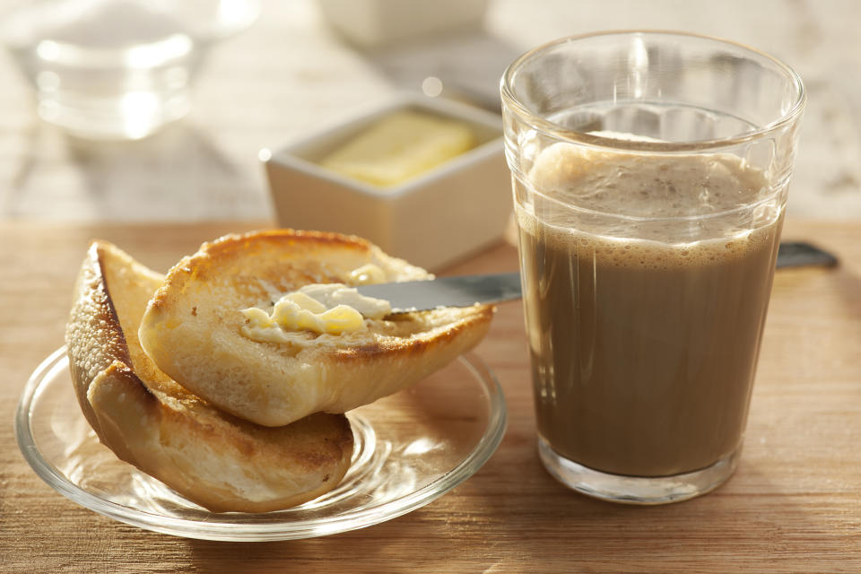 Pingado and break and butter, Brazilian version of the Latte Macchiato (caf&#xc3;&#xa9; com leite), it is a very popular everyday breakfast beverage, eaten with bread and butter, different from the Italian traditional Latte, it is prepared with hot milk, and coffee maker coffee, instead of whipped milk, and espresso, and it is served on a glass.