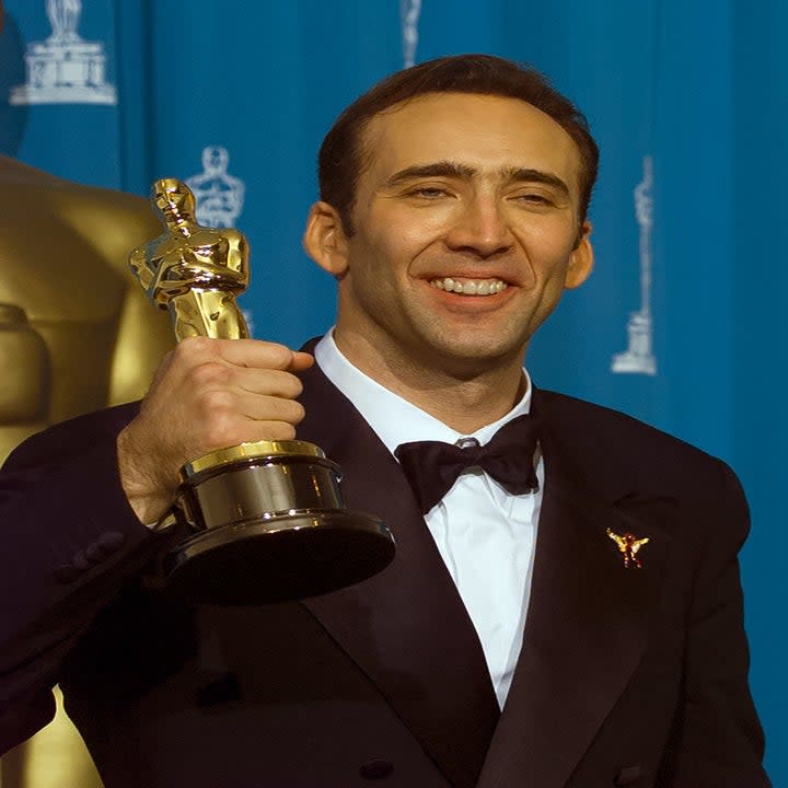 cage holding up an award