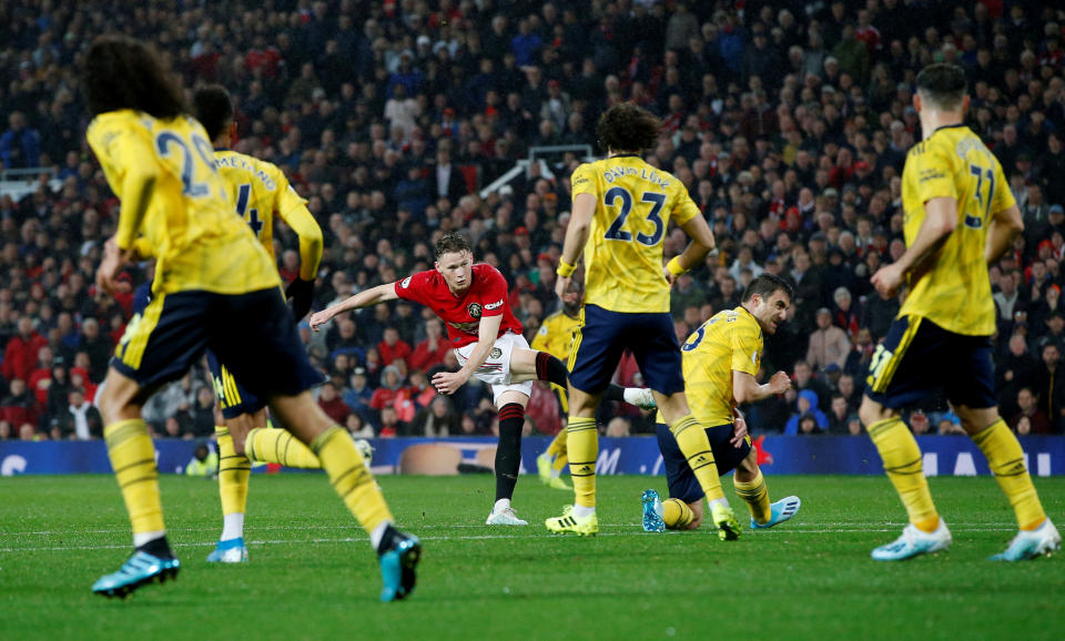 Soccer Football - Premier League - Manchester United v Arsenal - Old Trafford, Manchester, Britain - September 30, 2019   Manchester United's Scott McTominay scores their first goal    REUTERS/Andrew Yates    EDITORIAL USE ONLY. No use with unauthorized audio, video, data, fixture lists, club/league logos or "live" services. Online in-match use limited to 75 images, no video emulation. No use in betting, games or single club/league/player publications.  Please contact your account representative for further details.