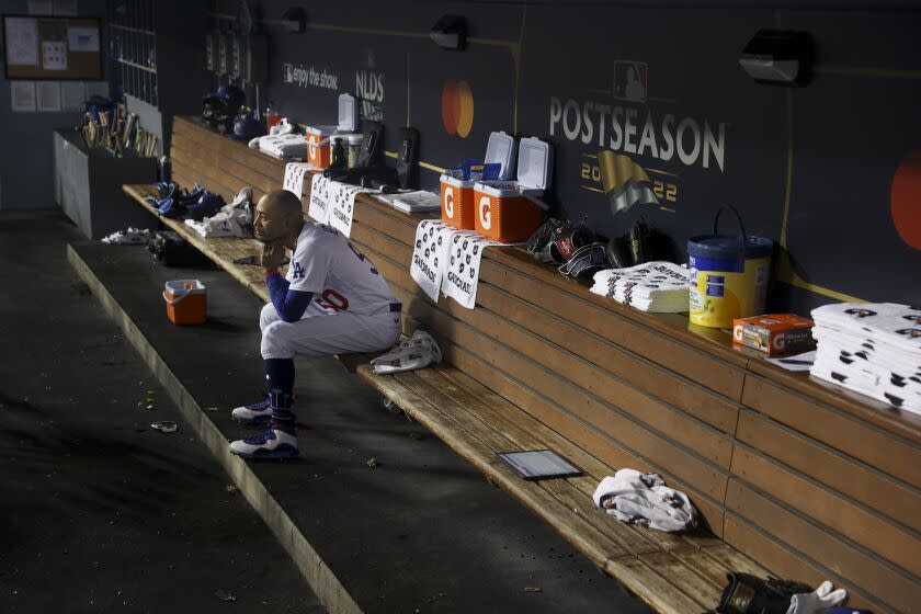 Los Angeles, CA - October 12: Los Angeles Dodgers' Mookie Betts sits alone on the bench during game two of the NLDS against the San Diego Padres at Dodger Stadium on Wednesday, Oct. 12, 2022 in Los Angeles, CA. The Padres won 5-3. (Robert Gauthier / Los Angeles Times)