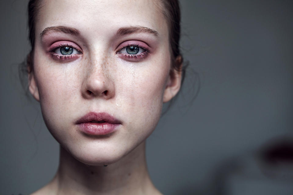 Woman crying with red eyes