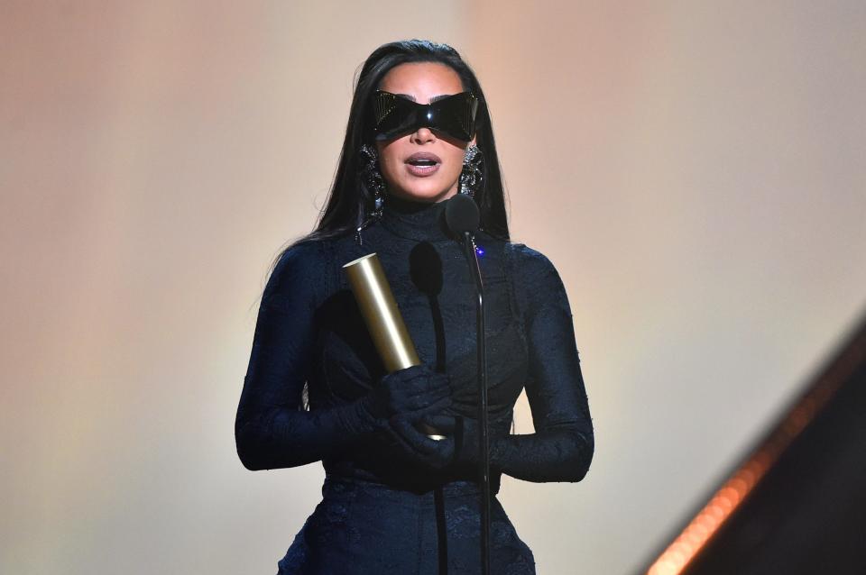 Kim Kardashian West accepts the Fashion Icon of 2021 award on stage during the 2021 People's Choice Awards.