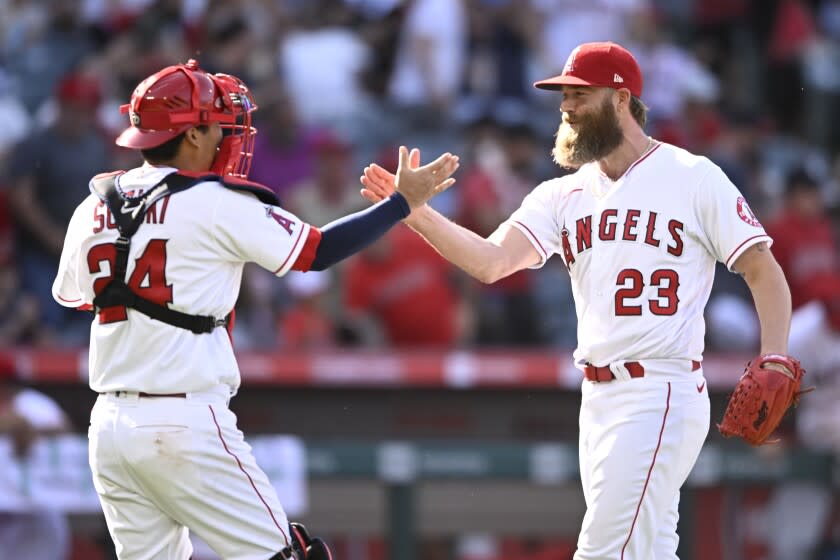 ANAHEIM, CA - APRIL 24: Pitcher Archie Bradley #23 and catcher Kurt Suzuki #24 of the Los Angeles Angels celebrate a 7-2 win over the Baltimore Orioles on April 24, 2022 at Petco Park in San Diego, California. (Photo by Denis Poroy/Getty Images)