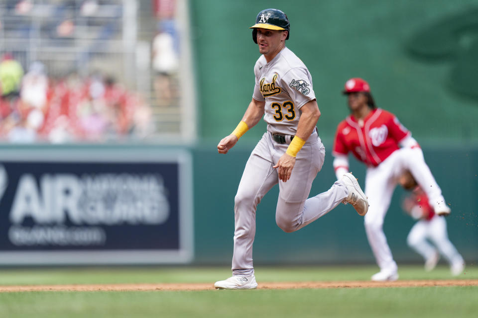 Oakland Athletics' JJ Bleday (33) runs toward third base to score during the third inning of a baseball game against the Washington Nationals, Sunday, Aug. 13, 2023, in Washington. (AP Photo/Stephanie Scarbrough)