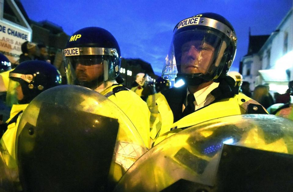 Riot police lined the streets as demonstrators gathered in Forest Gate (PA)