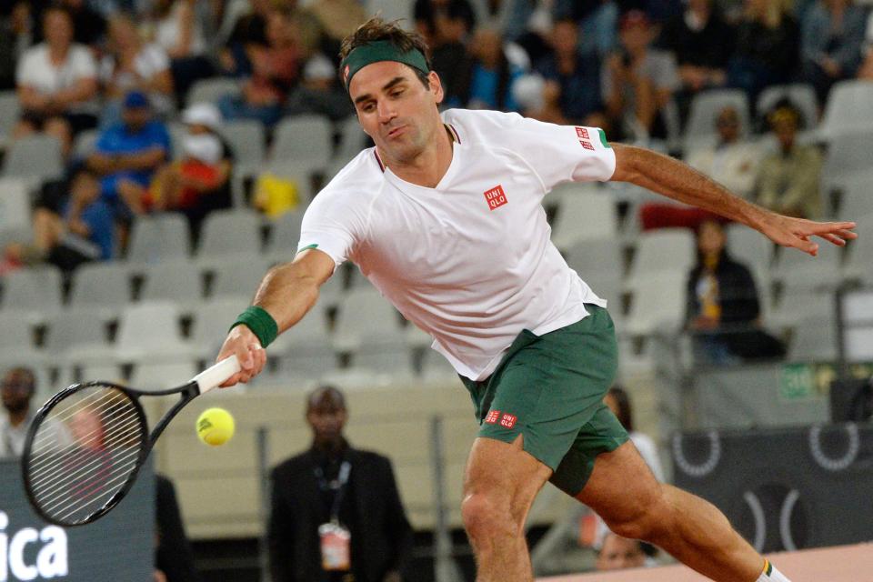 Roger Federer hits a forehand return to Rafael Nadal.