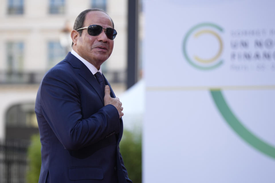 Egyptian President Abdel Fattah el-Sissi arrives for the closing session of the New Global Financial Pact Summit, Friday, June 23, 2023 in Paris. The aim of the two-day climate and finance summit was to set up concrete measures to help poor and developing countries whose predicaments have been worsened by the devastating effects of the COVID-19 pandemic and the war in Ukraine better tackle poverty and climate change. (AP Photo/Lewis Joly, Pool)