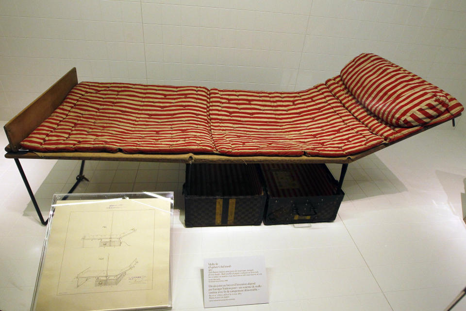 A Louis Vuitton 1891 Explorer's Bed Trunk is displayed at the Louis Vuitton-Marc Jacobs exhibit in the Art Decoratifs Musuem in Paris, Thursday, March 8, 2012. (AP Photo/Francois Mori)