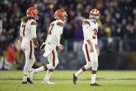 Cleveland Browns kicker Chase McLaughlin, right, looks on next to Jamie Gillan (7) and Charley Hughlett (47) after missing a field goal against the Baltimore Ravens during the first half of an NFL football game, Sunday, Nov. 28, 2021, in Baltimore. (AP Photo/Gail Burton)