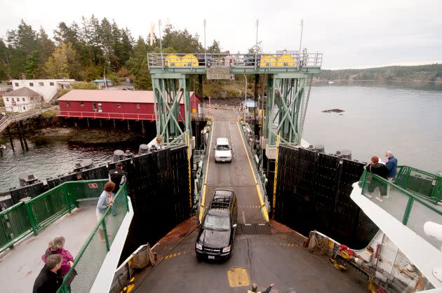 Automobiles board an inter-island car ferry en route to the mainland on Shaw Island in the San Juan Islands. (Photo: Nik Wheeler via Getty Images)