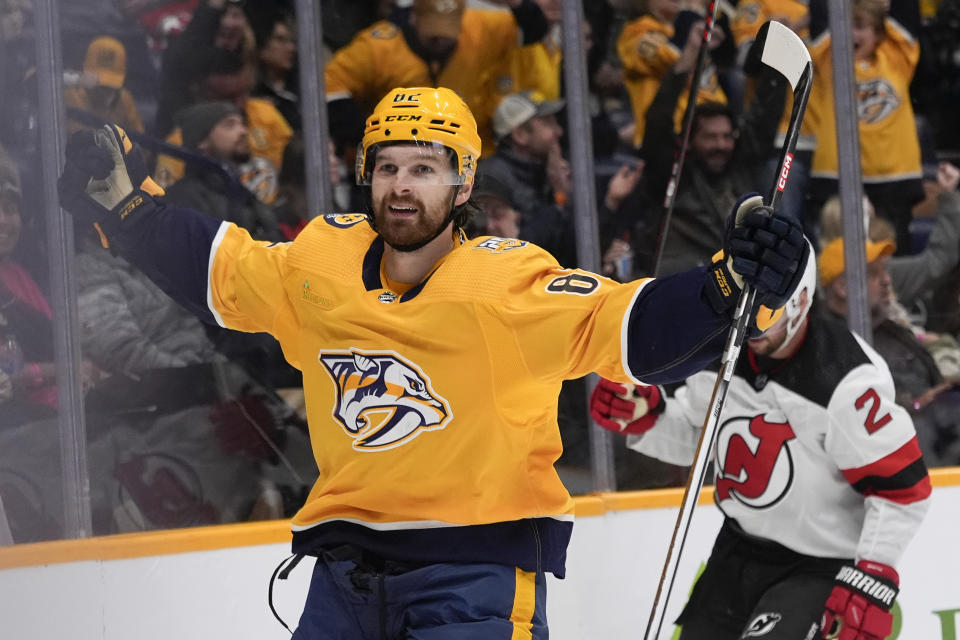 Nashville Predators center Tommy Novak (82) celebrates a goal against the New Jersey Devils during the second period of an NHL hockey game Tuesday, Feb. 13, 2024, in Nashville, Tenn. (AP Photo/George Walker IV)