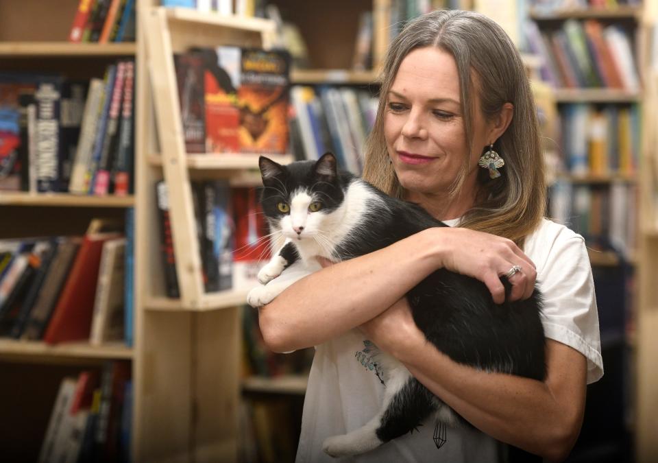 Keli Leatherwood holds WIlbur the cat, as seen Thursday, April 13, 2023.