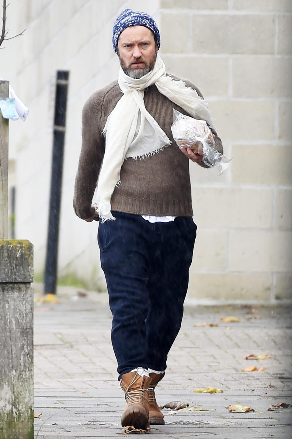 <p>Jude Law pops out to pick up some fresh bread on Wednesday in London.</p>