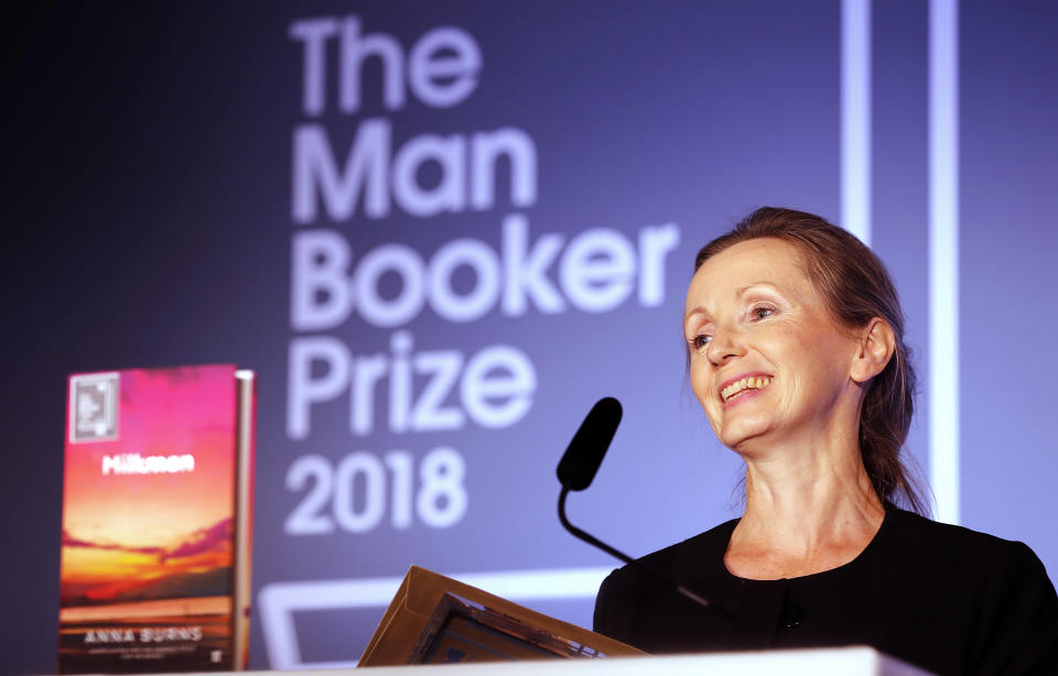 Writer Anna Burns smiles after she was presented with the Man Booker Prize for Fiction 2018 by Britain's Camilla, the Duchess of Cornwall during the prize's 50th year at the Guildhall in London, Tuesday, Oct. 16, 2018.(AP Photo/Frank Augstein, Pool)