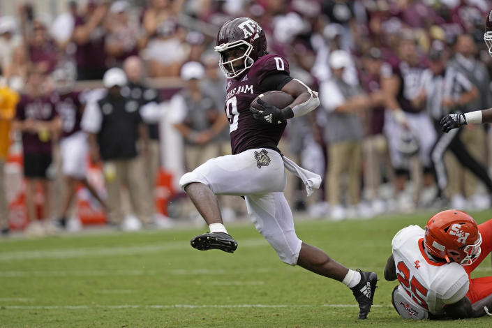 Texas A&M wide receiver Ainias Smith (0) breaks away from Sam Houston State defensive back B.J. Foster (25) after catching a pass to score a 63-yard touchdown during the first half of an NCAA college football game Saturday, Sept. 3, 2022, in College Station, Texas. (AP Photo/David J. Phillip)