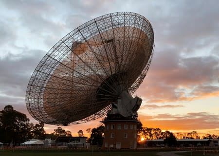 The radio telescope at the Parkes Observatory is pictured at sunset near the town of Parkes