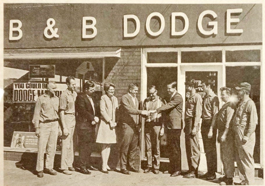 On April 26, 1970, surrounded by their employees, three Carmody brothers (Bob, John and Steve) from Honesdale opened B&B Dodge. From left are Wes Weber, Bill Tennant, Gary Peck, Agnes Weidner, Bob Carmody, the seller Bob McKinnell, John Carmody, Steve Carmody, Art Meyer, and Charlie Schaff. The picture was taken by Bob Jennings Photography.