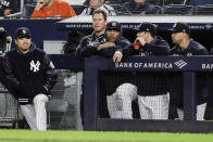 New York Yankees starting pitcher Masahiro Tanaka, of Japan, left, watches with teammates during the ninth inning of the team's baseball game against the Los Angeles Angels on Wednesday, Sept. 18, 2019, in New York. The Angels won 3-2. (AP Photo/Frank Franklin II)