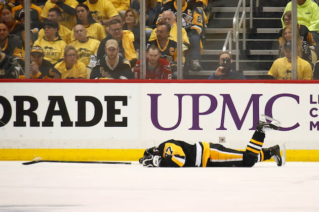 PITTSBURGH, PA – MAY 01: Sidney Crosby #87 of the Pittsburgh Penguins lies on the ice after taking a hit in the first period while playing the Washington Capitals in Game Three of the Eastern Conference Second Round during the 2017 NHL Stanley Cup Playoffs at PPG Paints Arena on May 1, 2017 in Pittsburgh, Pennsylvania. (Photo by Gregory Shamus/Getty Images)