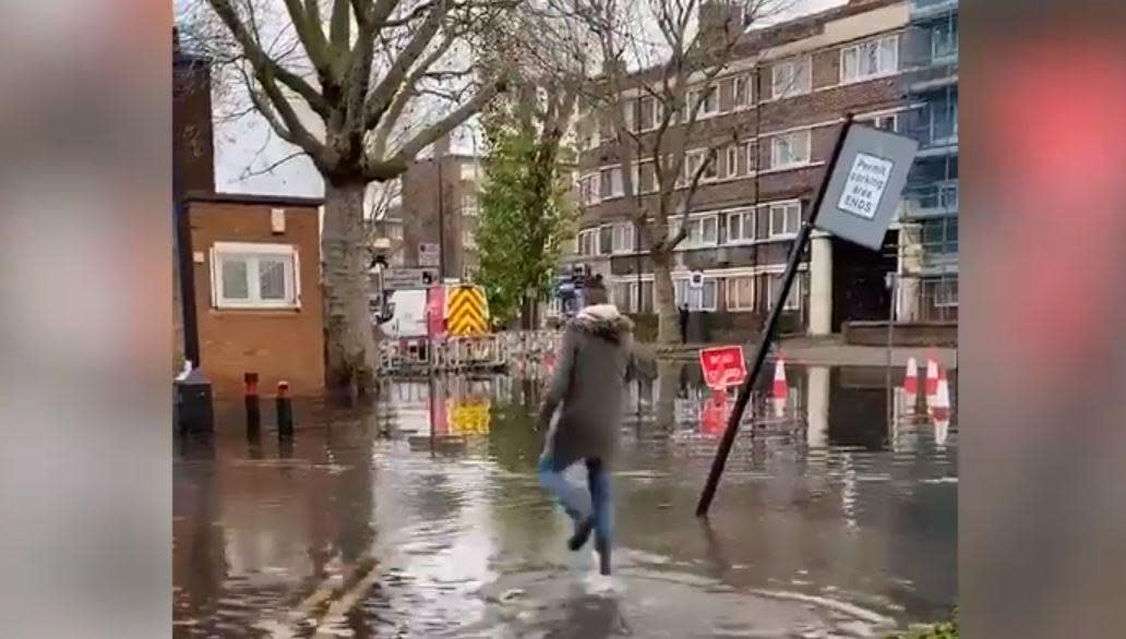 Voters wade through floodwater on their way to the polling station in Bermondsey: Hannah Tookey