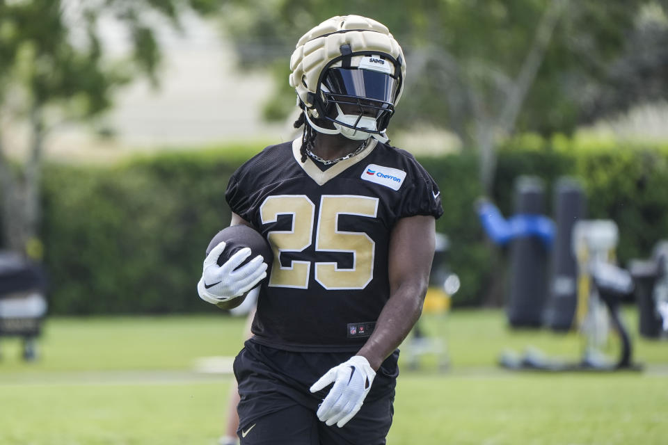New Orleans Saints running back Kendre Miller (25) runs through drills during NFL football practice in Metairie, La., Tuesday, May 21, 2024. (AP Photo/Gerald Herbert)