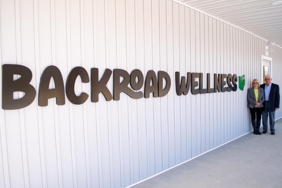 Deb and Pat Hennessey outside of their new Cambridge dispensary, Backroad Wellness.