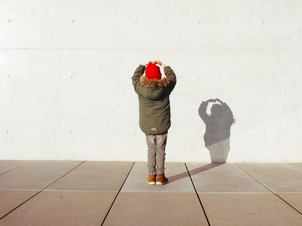 Child playing with shadow