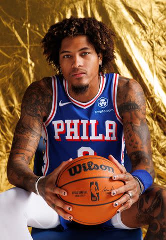 <p>Tim Nwachukwu/Getty</p> Kelly Oubre Jr. poses for a portrait during Philadelphia 76ers media day