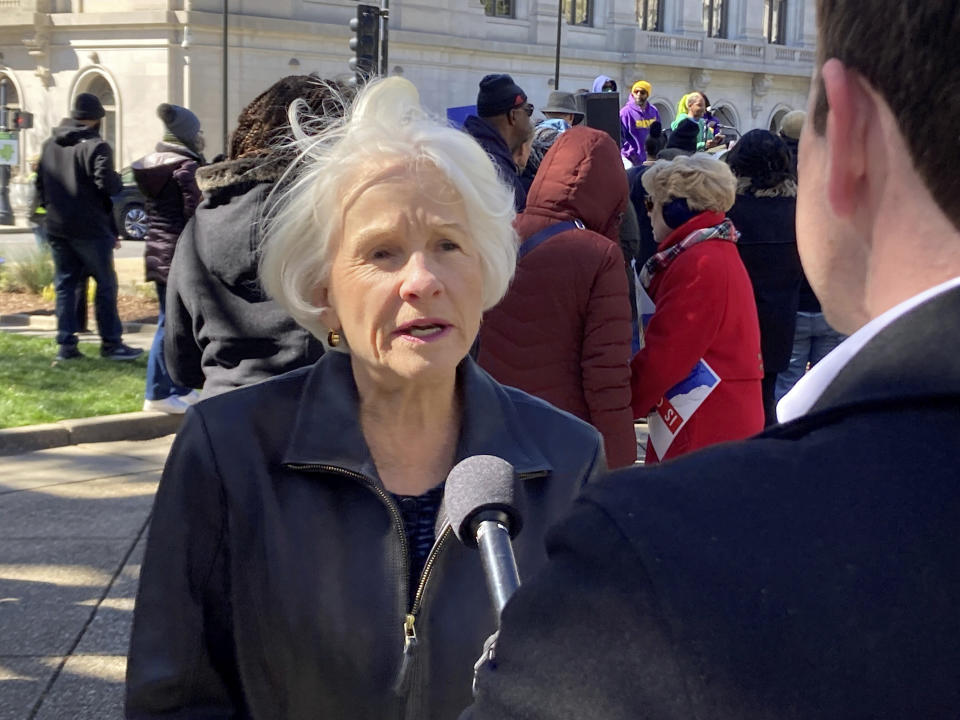 Rebecca Harper of Cary speaks to reporters at the "People's Rally" on Union Square in downtown Raleigh, N.C., on Tuesday, March 14, 2023. Harper is the lead named plaintiff in litigation challenging North Carolina legislative and congressional maps. The state Supreme Court heard oral arguments Tuesday on whether earlier court rulings in Harper's case that declared partisan gerrymandering violated the state constitution should be reversed or withdrawn. (AP Photo/Gary D. Robertson)