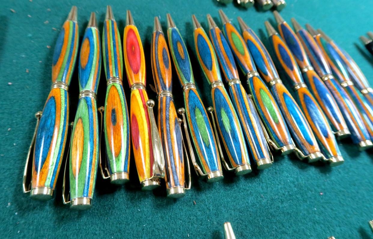 Some of Paul DeSaro's "Exotic Wood Pens" are displayed in his Middletown home Tuesday, January 2, 2023. He uses wood sourced from all over the world.