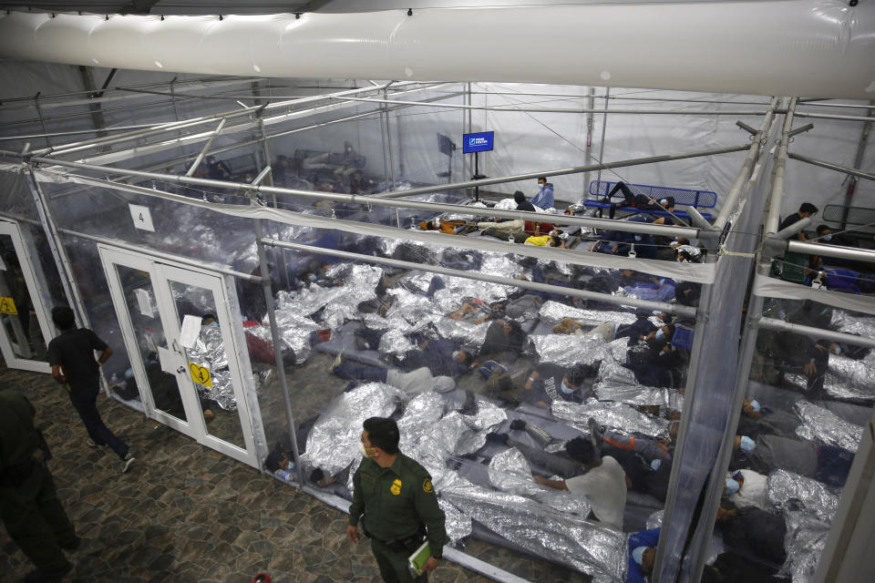 FILE - Children lie inside a pod at the main detention center for unaccompanied children in the Rio Grande Valley run by U.S. Customs and Border Protection (CBP), in Donna, Texas, March 30, 2021. A company that provides services for immigrants in federal detention was ordered Tuesday, April 2, 2024, to pay more than $811 million in restitution and penalties in a lawsuit alleging it used deceptive and abusive tactics. (AP Photo/Dario Lopez-Mills, Pool, File)