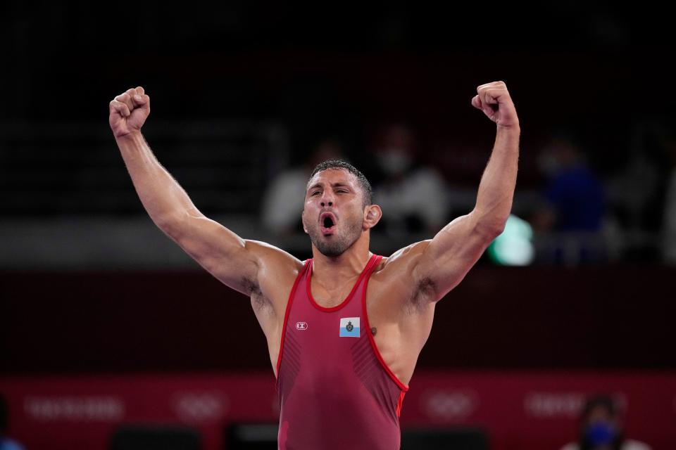 San Marino's Myles Amine celebrates after defeating India's Deepak Punia during the men's 86-kilogram freestyle wrestling bronze-medal match at the Summer Olympics on Aug. 5, 2021, in Tokyo.