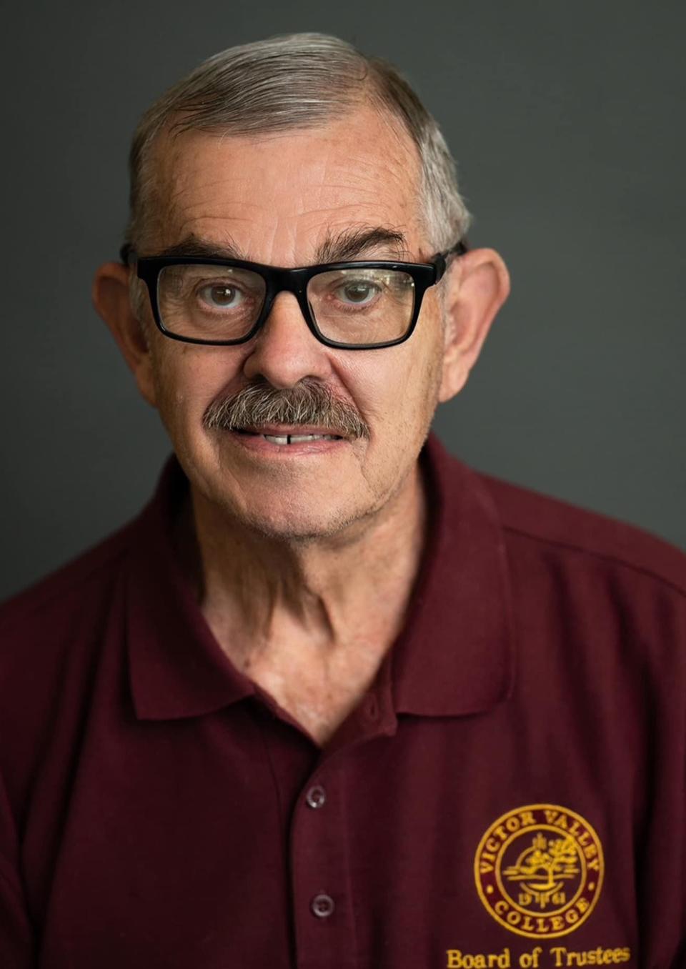 Victor Valley College officials announced the death of 77-year-old Dennis L. Henderson, the longest-serving member of the college Board of Trustees.