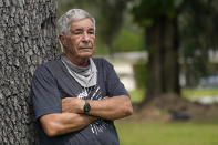 James Farr stands for a portrait outside his gated community, Good Samaritan Society – Kissimmee Village, Friday, Sept. 25, 2020, in Kissimmee, Fla. While working as a Bible translator in Papua New Guinea in 2016, he voted for Donald Trump by absentee ballot. Now back in the States, he is appalled at how Trump treated the Kurds. “I really am scared with what Trump does. Feels like he’s able to do anything and get away with it.” (AP Photo/John Raoux)
