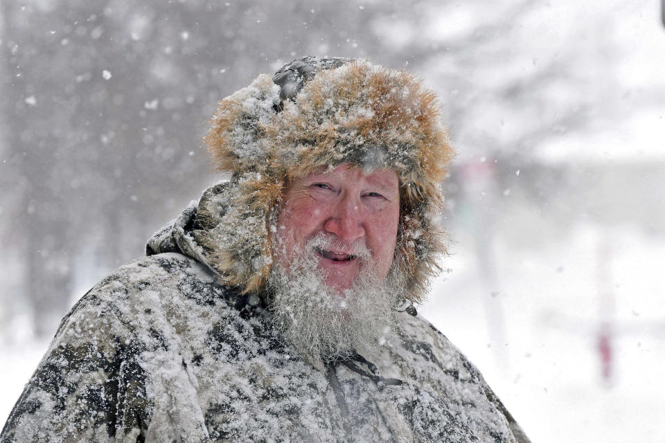 Mike Howarth is dressed for the winter weather while shopping in downtown Bismarck, N.D., on Wednesday, Dec. 14, 2022. (Tom Stromme/The Bismarck Tribune via AP)