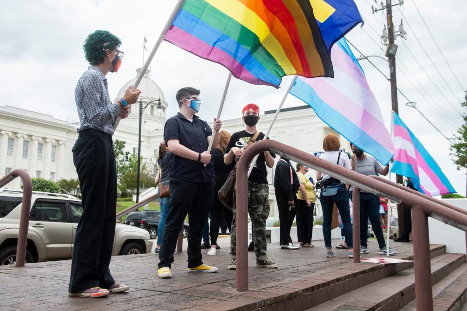 Protesters in support of transgender rights rally outside the Alabama State House in Montgomery, Alabama, on March 30, 2021.