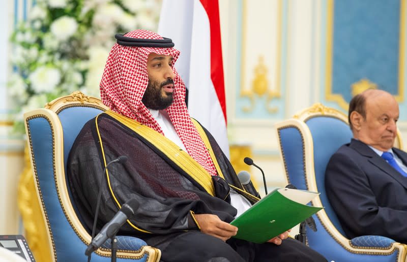 Saudi Crown Prince Mohammed bin Salman speaks as Yemen's President Abd-Rabbu Mansour Hadi is seen in the background, in Riyadh