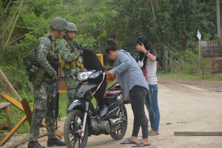 Philippine marines operate a military check point along a highway in Indanan town, Sulu province on February 27, 2017