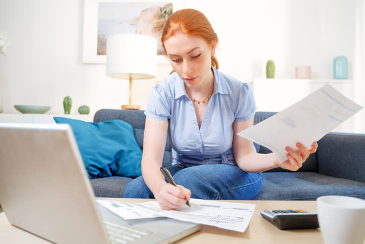 A woman filling out her primary residence on a tax form.