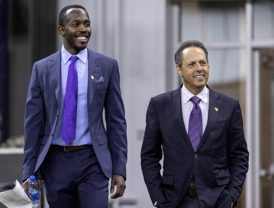 Minnesota Vikings president Mark Wilf, right, and new general manger Kwesi Adofo-Mensah walk into a press conference Thursday, Jan. 27, 2022 at TCO Performance Center in Eagan, Minn.(Carlos Gonzalez/Star Tribune via AP)