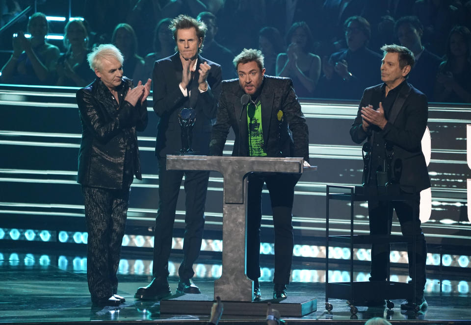 Inductees Nick Rhodes, from left, John Taylor, Simon Le Bon, and Roger Taylor of Duran Duran speak during the Rock & Roll Hall of Fame Induction Ceremony on Saturday, Nov. 5, 2022, at the Microsoft Theater in Los Angeles. (AP Photo/Chris Pizzello)