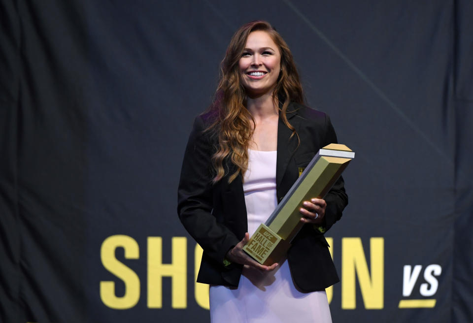 LAS VEGAS, NV - JULY 05:  Ronda Rousey holds a trophy onstage after becoming the first female inducted into the UFC Hall of Fame at The Pearl concert theater at Palms Casino Resort on July 5, 2018 in Las Vegas, Nevada.  (Photo by Ethan Miller/Getty Images)