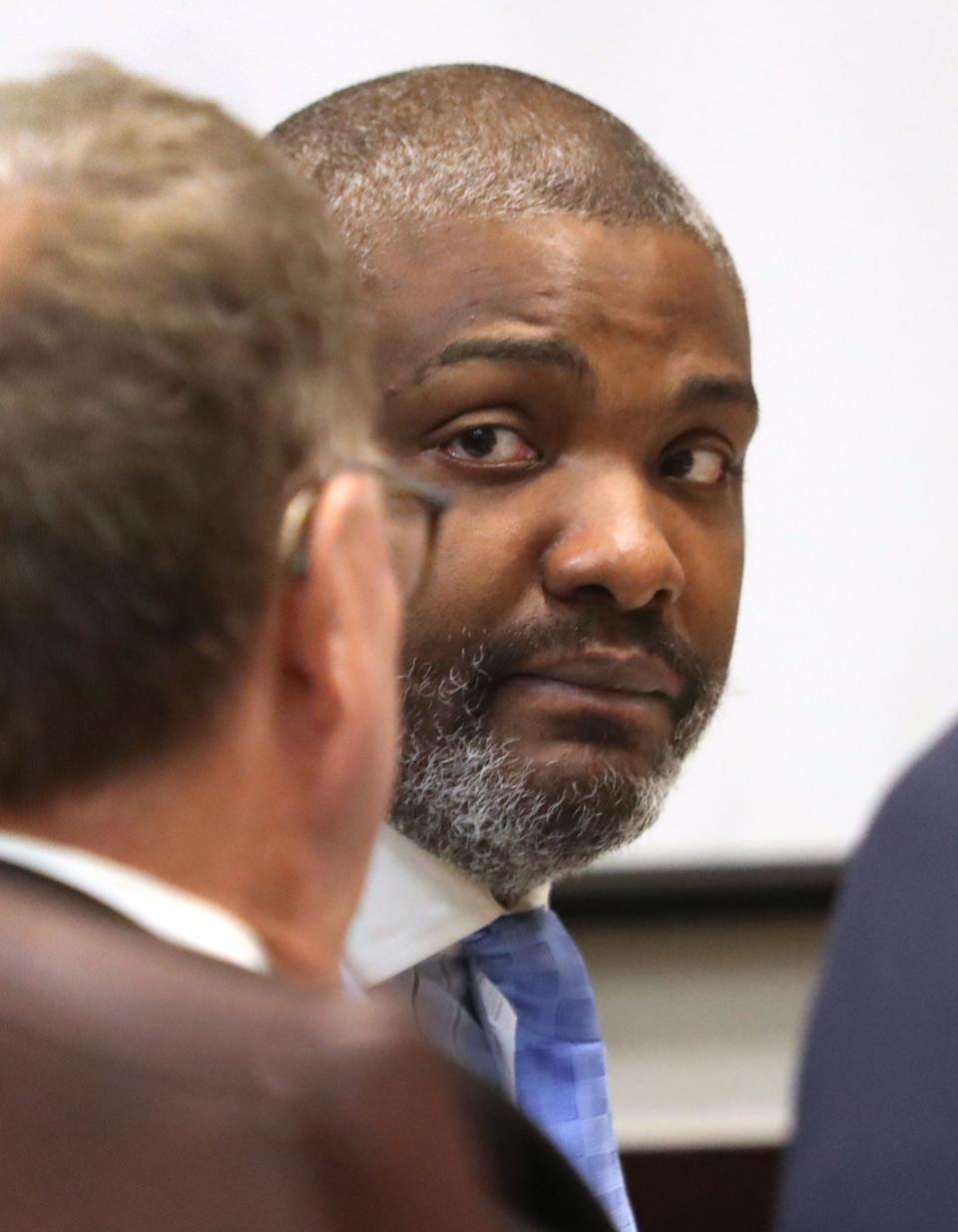 Convicted serial killer Robert Hayes talks with his attorney Chris Anderson in February 2022, as his trial begins before Judge Raul Zambrano at the S. James Foxman Justice Center in Daytona Beach.