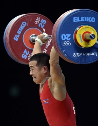 North Korea's Om Yun-Chol competes at the men's 56kg weightlifting event on July 29. The tiny, 1.52m weightlifter put North Korea on the gold trail when he lifted three times his bodyweight to win the 56kg category with a world record-equalling 293kg