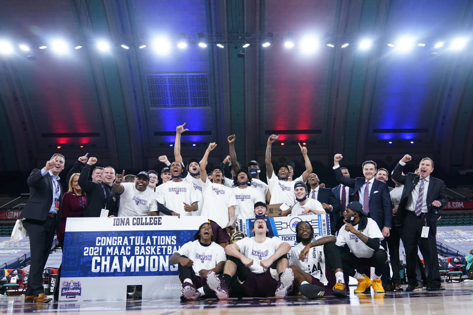 Iona players and personnel celebrate after winning an NCAA college basketball game against Fairfield during the finals of the Metro Atlantic Athletic Conference tournament, Saturday, March 13, 2021, in Atlantic City, N.J. (AP Photo/Matt Slocum)