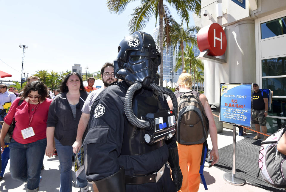 Fans wait in line outside of Hall H on day 1 of the 2014 Comic-Con International Convention held Thursday, July 24, 2014 in San Diego. (Photo by Denis Poroy/Invision/AP)